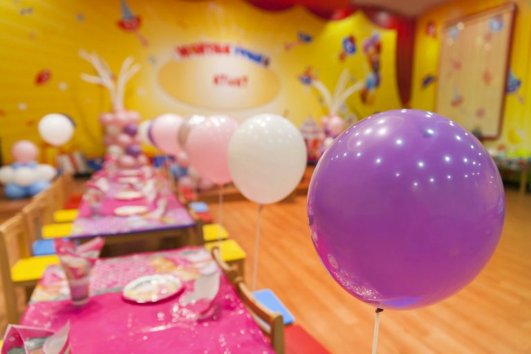 Birthday party room decorations with colorful balloons